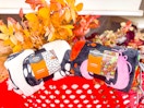 2 plush halloween blankets sitting on a cart