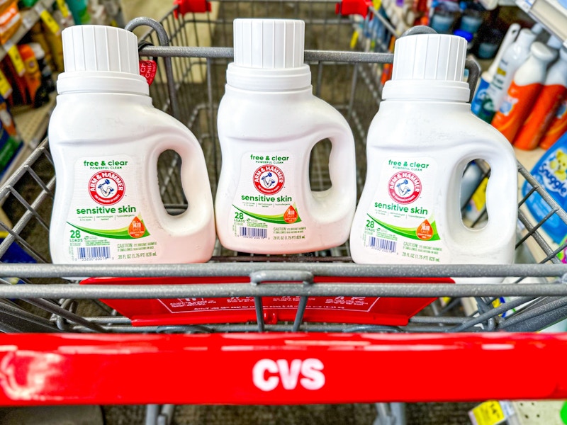 3 bottles of laundry detergent in a cvs cart