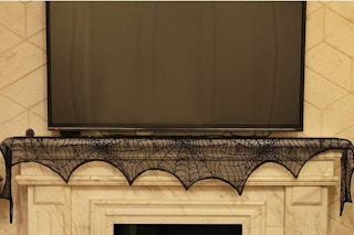 a spider web decoration under a TV