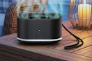 a mosquito repellent device on a table