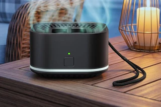 a mosquito repellent device on a table