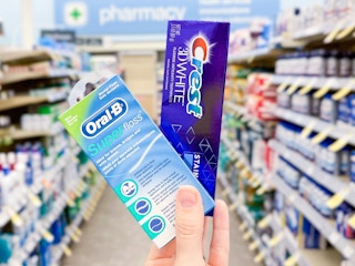 hand holding crest and oral-b products