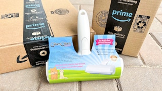 a pet hair roller next to two Amazon boxes