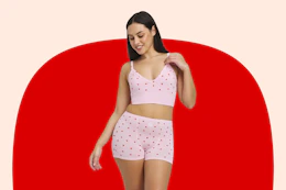 Woman wearing a strawberry printed bralette and pair of matching underwear