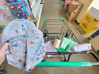 school supplies in a cart at dollar tree