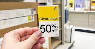 a person holding a target clearance tag