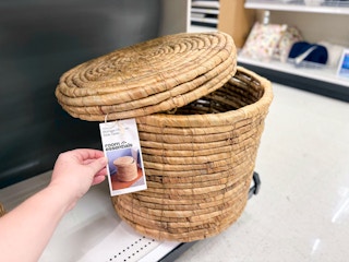 room essentials woven storage ottoman sitting on a target shelf