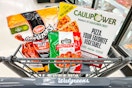tyson, cooked perfect, and caulipower frozen foods in a walgreens shopping cart