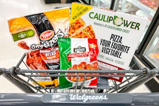 tyson, cooked perfect, and caulipower frozen foods in a walgreens shopping cart
