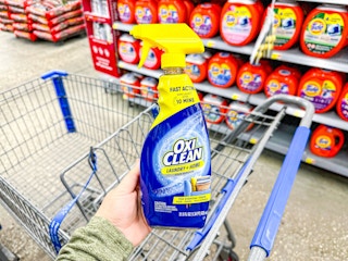Oxi Clean Stain Remover held over Walmart shopping cart
