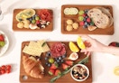 food on three cutting boards