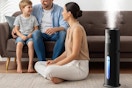 a family next to a humidifier