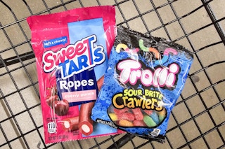 sweetarts and trolli candy in a cart