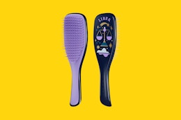 tangle teezer brush on a yellow background