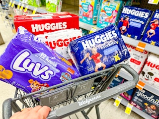 person pushing a cart full of diapers