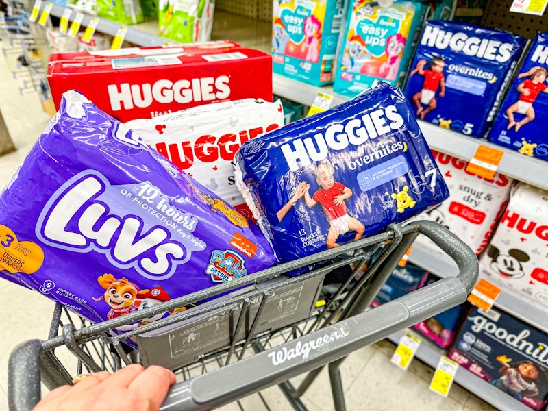 person pushing a cart full of diapers