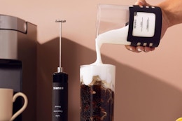 a keurig milk frother pouring milk into a cup