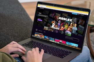 A person on a computer looking at online games on the Prime Gaming website page.