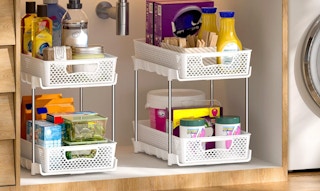 two organizers with products under a sink