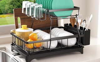 dishes in a 2-tier rack on a kitchen counter