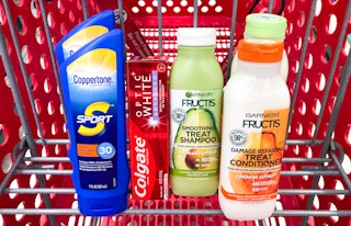 bottles of shampoo and sunscreen in shopping cart