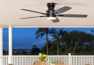 a ceiling fan on the roof of a patio 