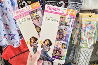 person holding 2 packs of disney encanto kids underwear