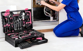 a person using a tool kit to repair wires