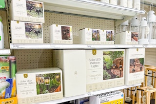 threshold outdoor lights sitting on a target shelf