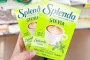 hand holding boxes of splenda sweetener