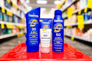 three coppertone sunscreen products in a store aisle