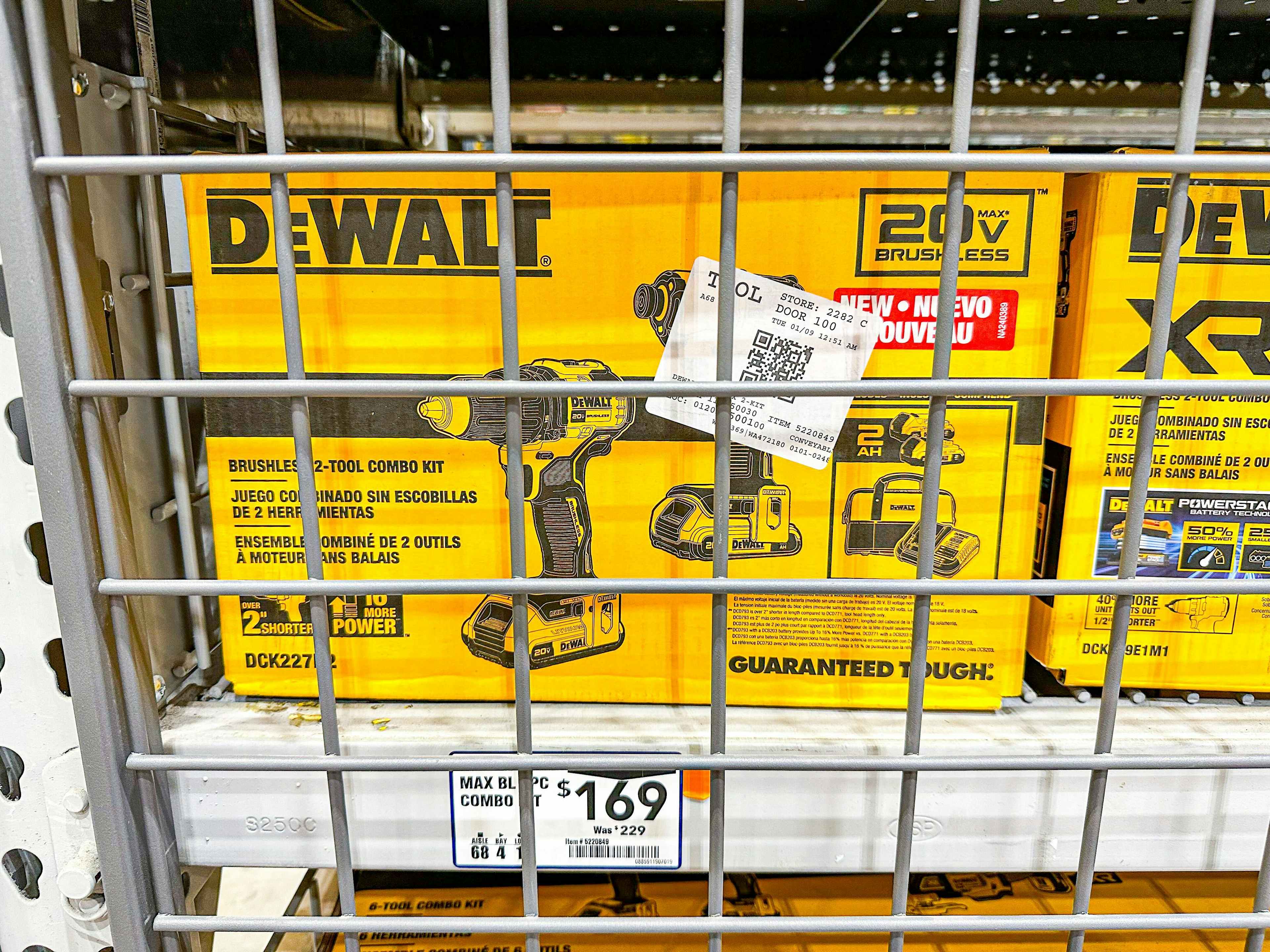 dewalt tool combo kit behind a cage at lowes