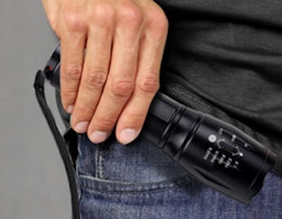 a person holding a flashlight