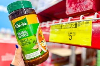 hand holding a bottle of knorr bouillon