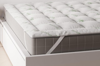 Twin mattress topper on bed