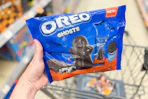 hand holding up a bag of oreo halloween ghosts