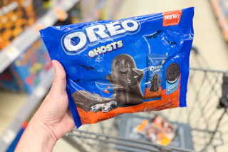hand holding up a bag of oreo halloween ghosts