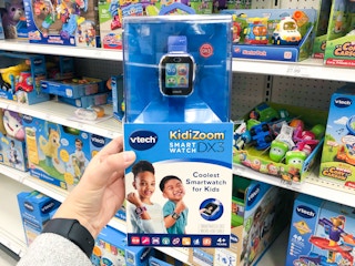 hand holding a v-tech kidizoom smartwatch