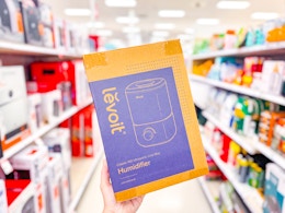 hand holding a levoit humidifier in a target aisle