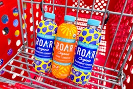 3 roar enhanced drinks sitting in a target cart