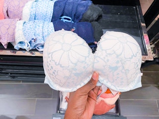 hand holding lacy bra