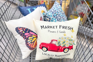 patio pillows in a shopping cart at Walmart