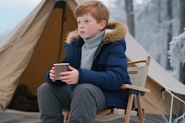 a boy wearing a puffer jacket