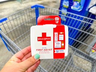 First-Aid Kit (Travel Size Mini) held over Walmart shopping cart