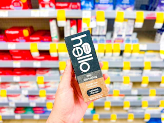 hand holding hello whitening toothpaste in walgreens
