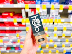 hand holding hello whitening toothpaste in walgreens