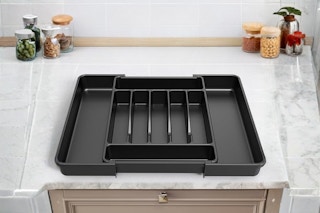 a silverware organizer on a kitchen countertop