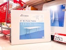 peakform folding banquet table sitting in front of a target shelf