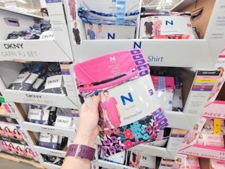 hand holding a 2-pack of ladies' sleep shirts