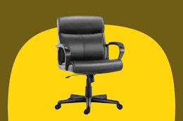 black leather-look office chair with one adjustment lever and five casters and arms